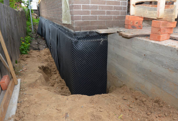 SJ Waterproofing Pros technician performing targeted Waterproofing assessment in Pompeii, MI